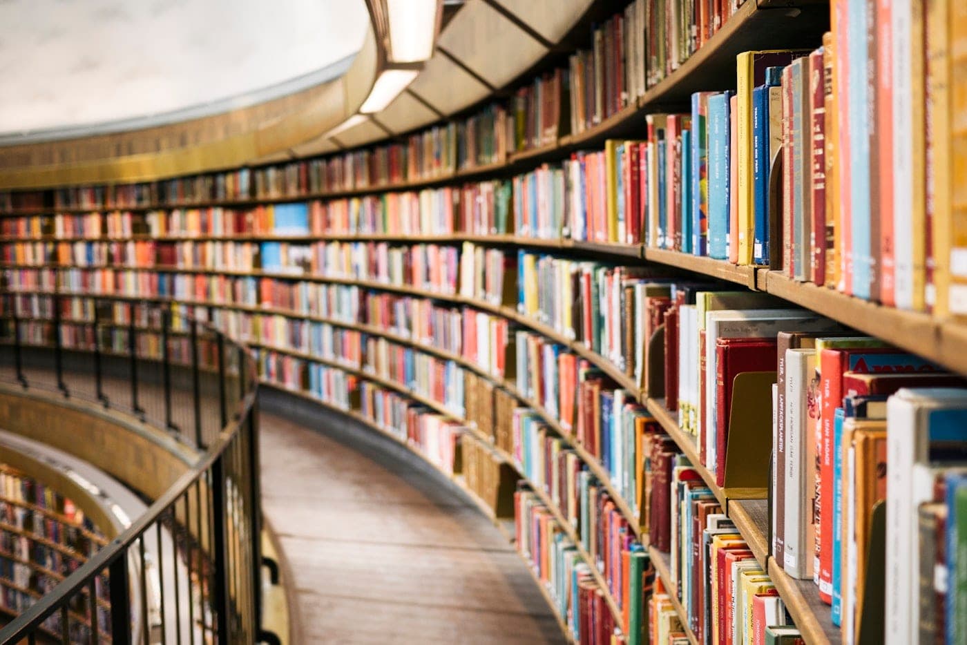 Warm light falling across books and a quiet reading space